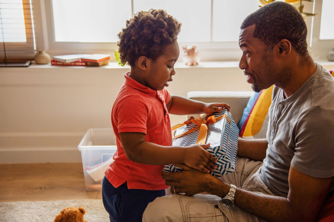 Child giving his father the best gifts for dad