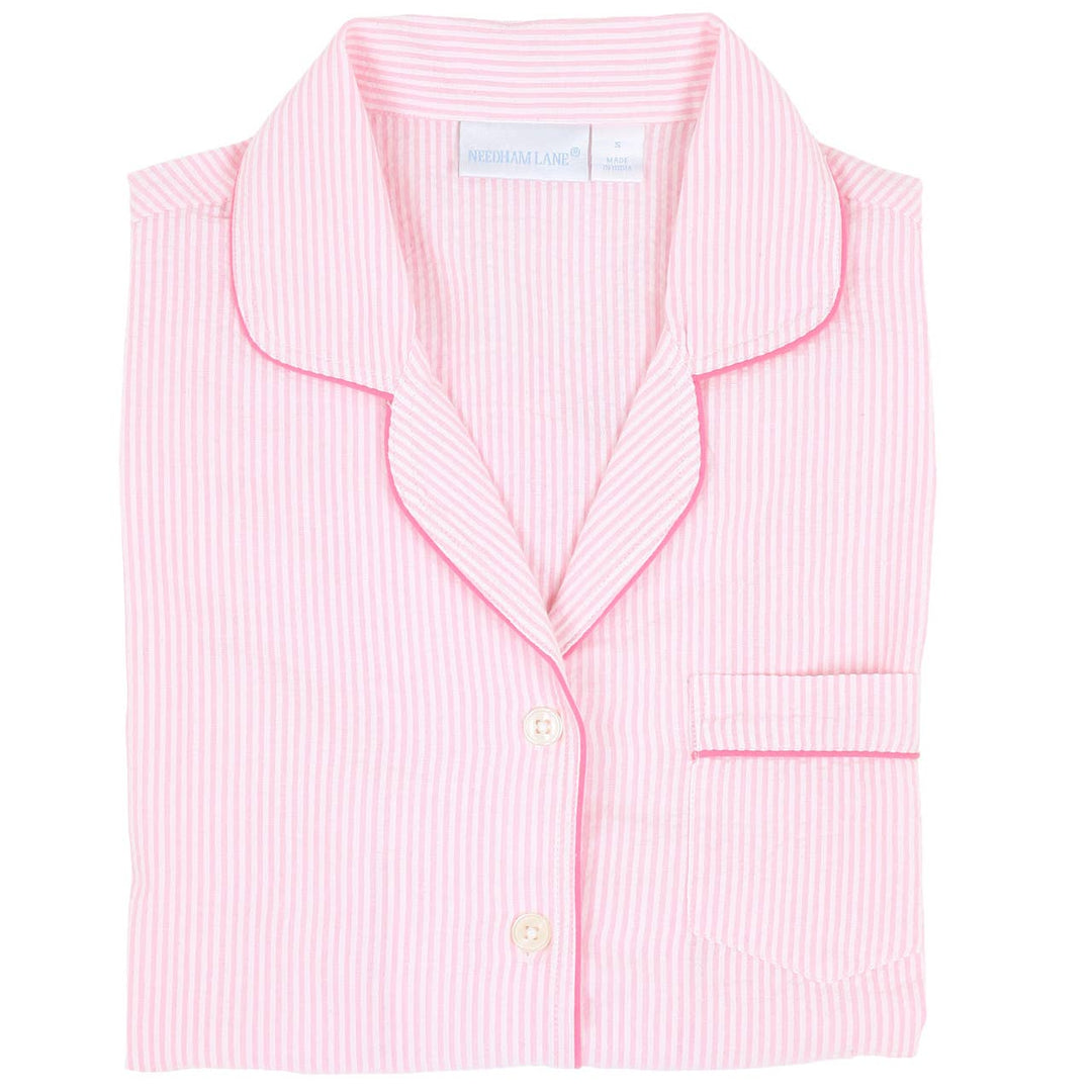 Pink striped pajama top with white collar on a white background