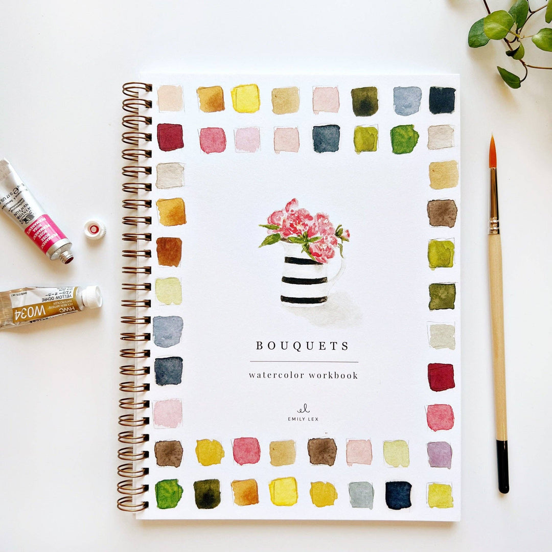 Watercolor workbook titled 'Bouquets' with color swatches and a paintbrush on a white background