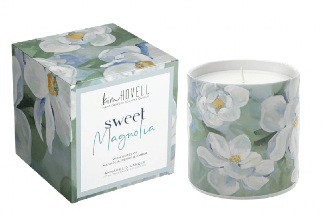 Candle with floral design packaging featuring 'kim hovell' branding.