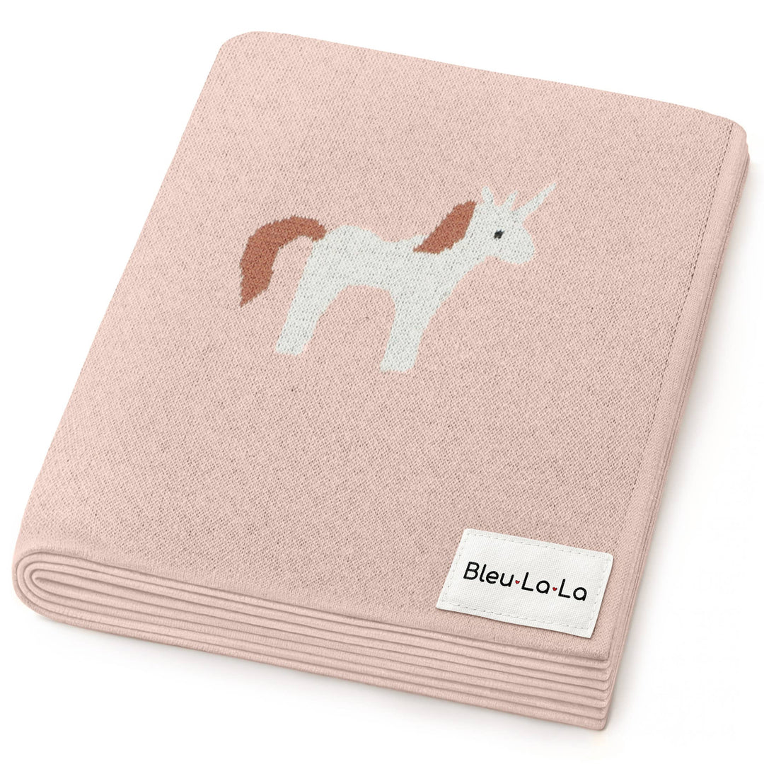 Pink blanket with unicorn design and Bleu-La-La label on a white background