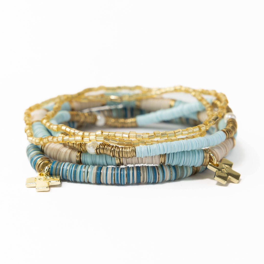 Set of colorful beaded bracelets on a white background