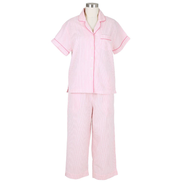 Pink pajama set on a mannequin against a white background