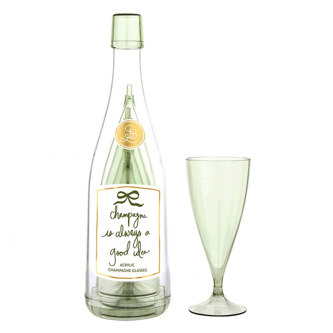 Green champagne bottle and glass with a label on a white background