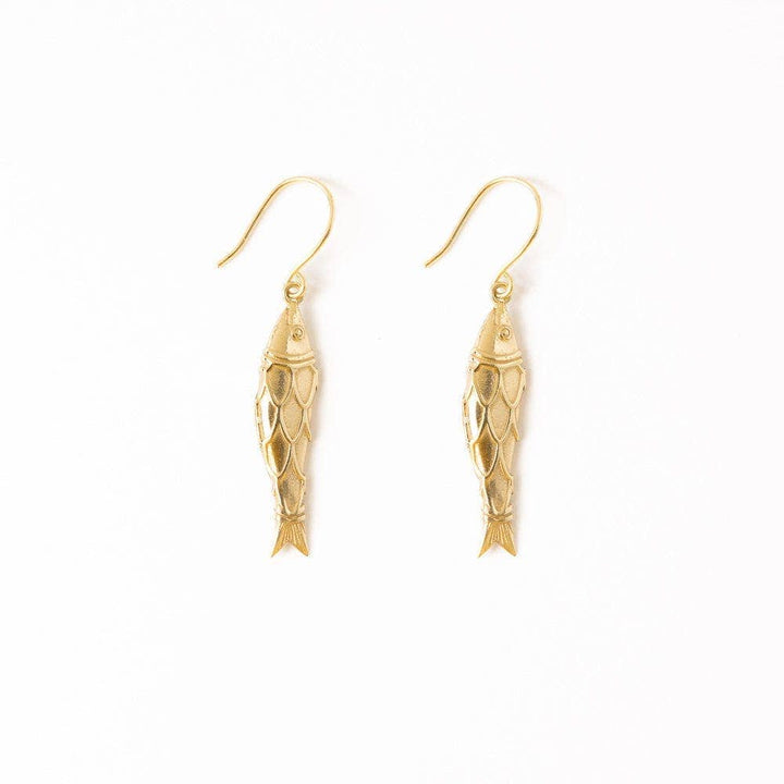 Gold fish-shaped earrings on a white background