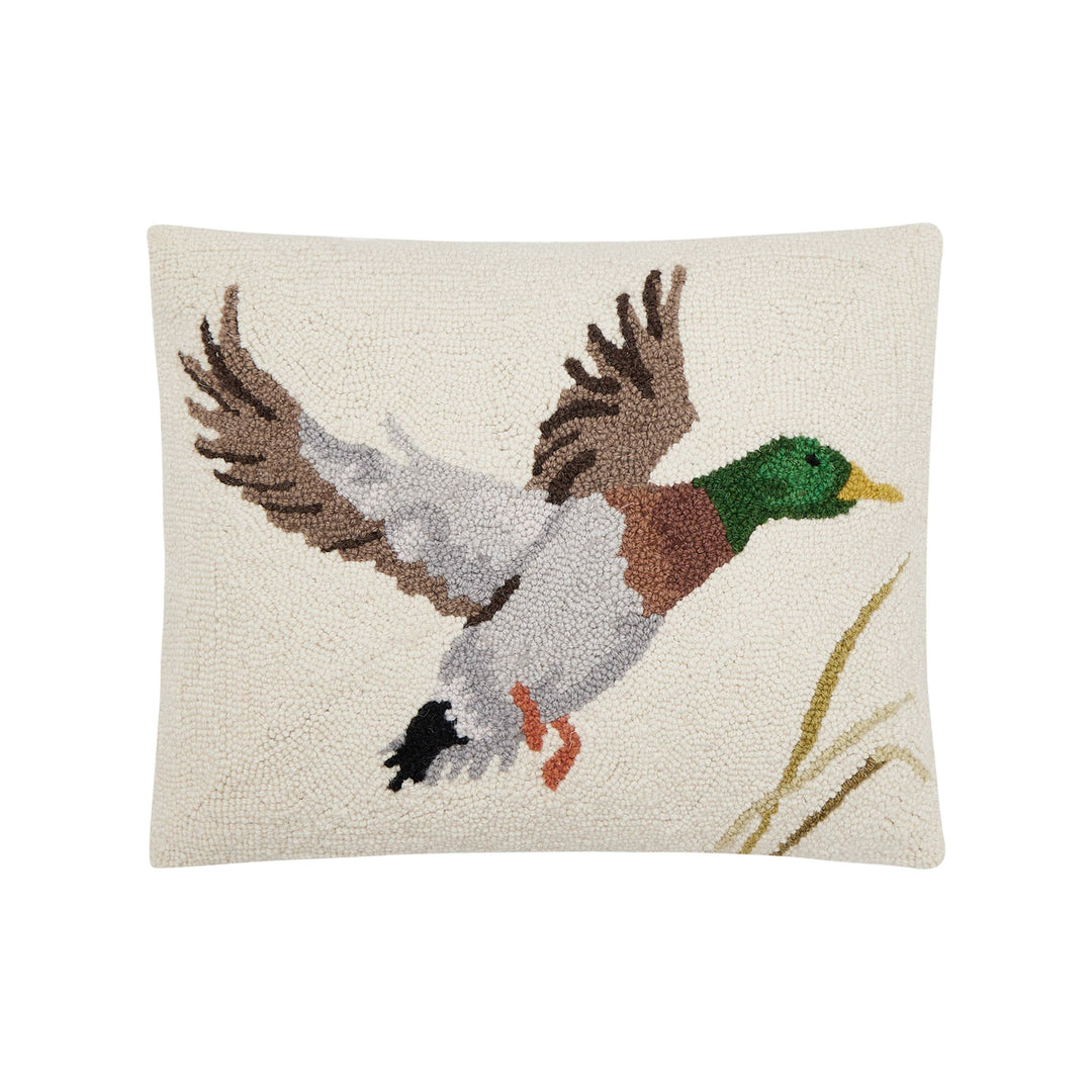 Decorative pillow with a flying duck design on a white background