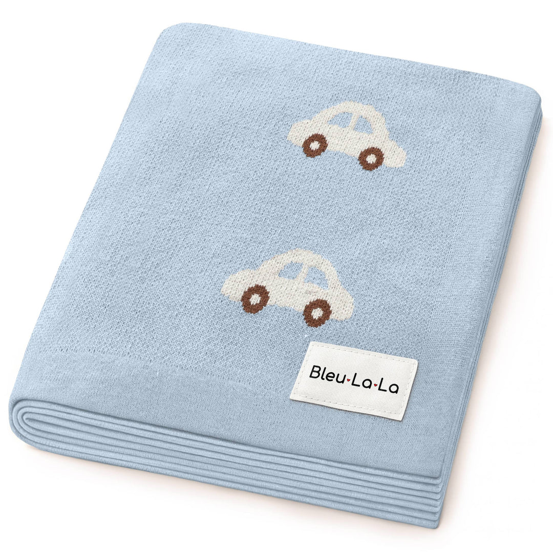 Blue blanket with embroidered cars and 'Bleu-La-La' label on a white background