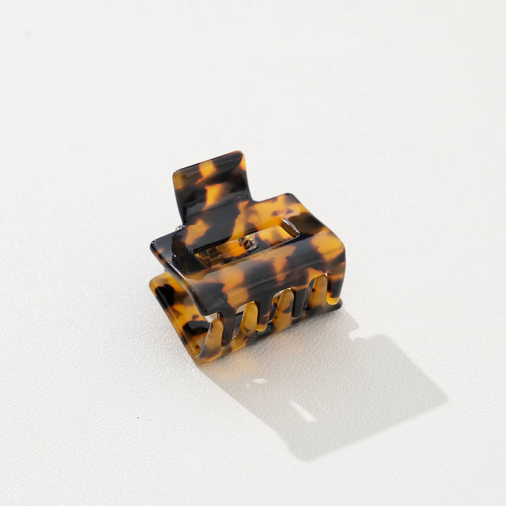 Tortoiseshell hair clip on a white background