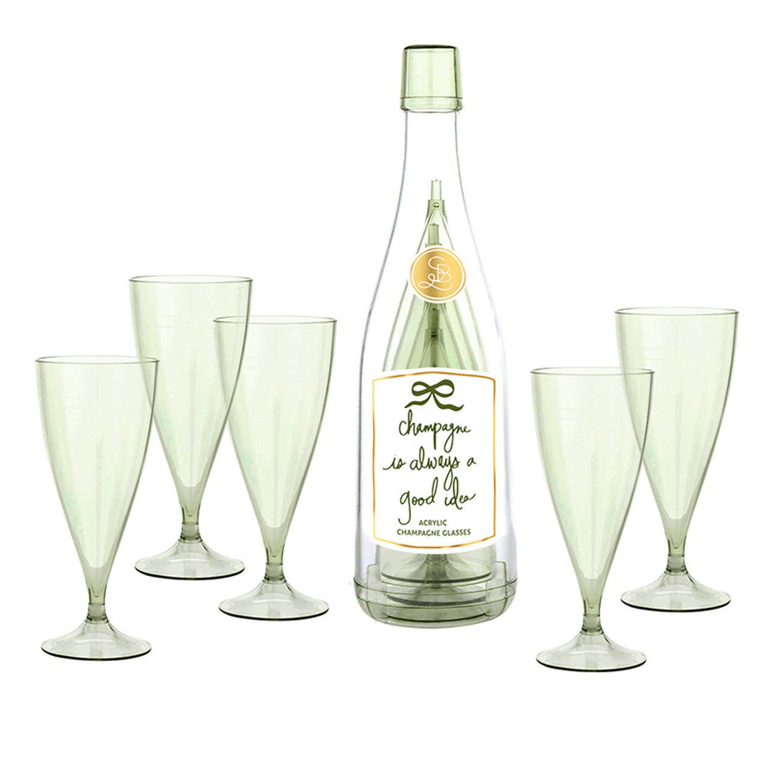 Set of green champagne flutes with a bottle labeled 'Champagne is always a good idea' on a white background