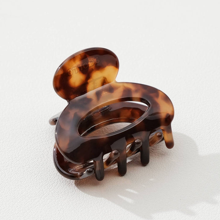 Tortoiseshell hair clip on a white background