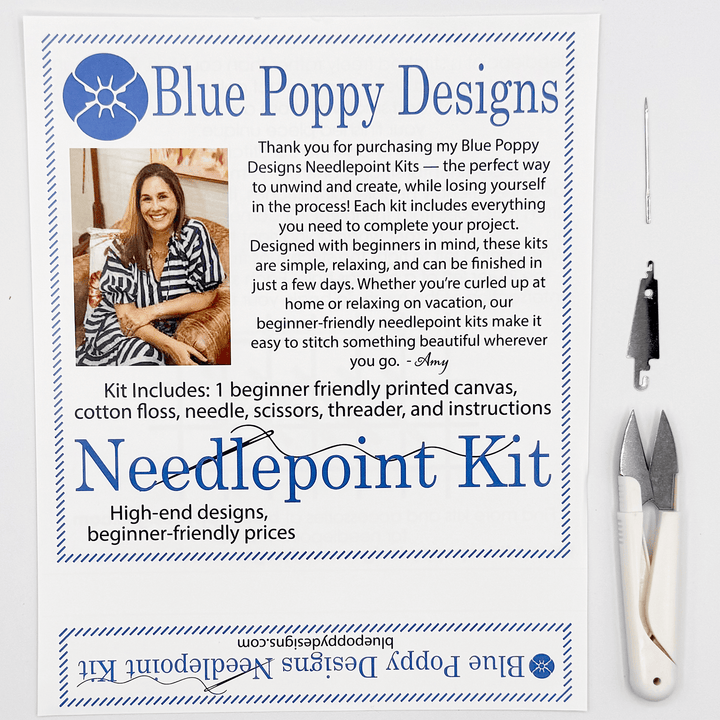 Blue Poppy Designs needlepoint kit with tools on a white background