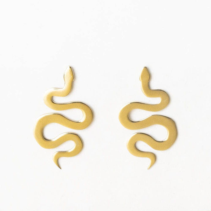 Gold snake-shaped earrings on a white background
