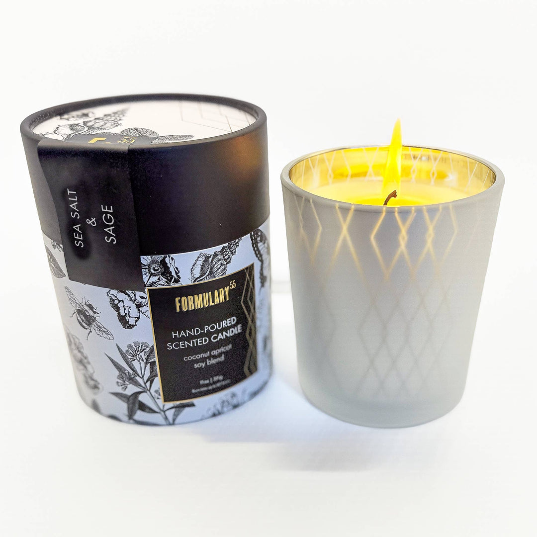 Candle with packaging labeled 'Sea Salt & Sage' by Formulary 360 on a white background