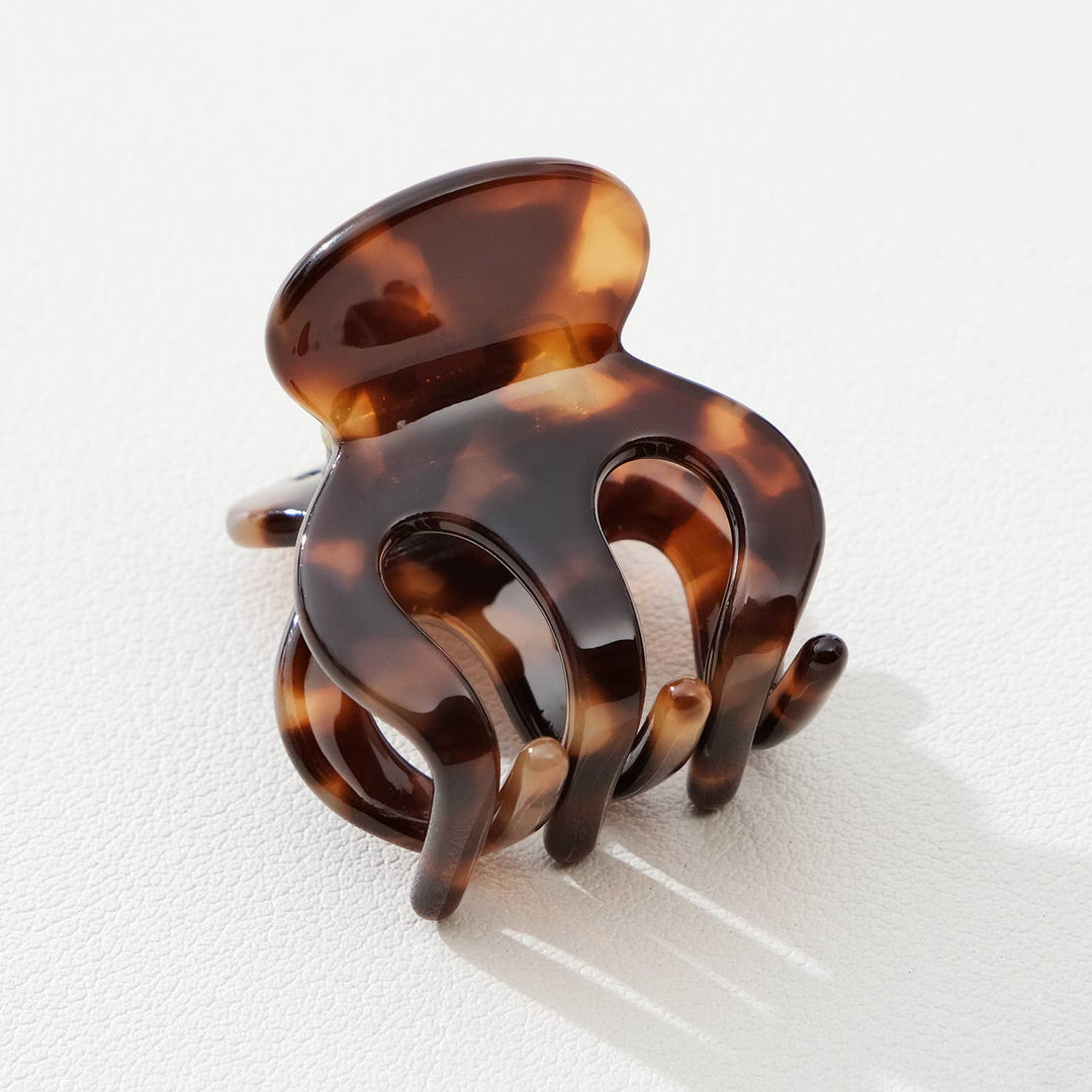 Tortoiseshell hair clip on a white background