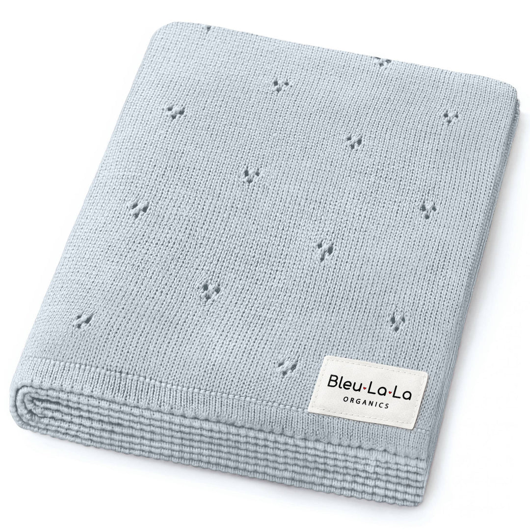 Folded gray baby blanket with 'Bleu La La Organics' label on a white background