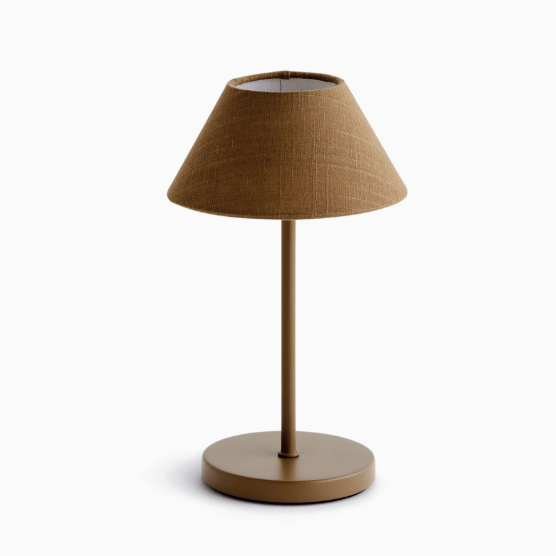 Brown table lamp with a textured shade on a white background