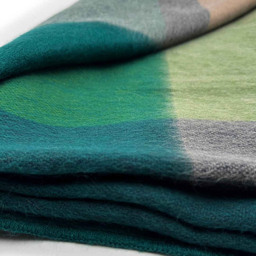 Stack of green and gray fabric swatches