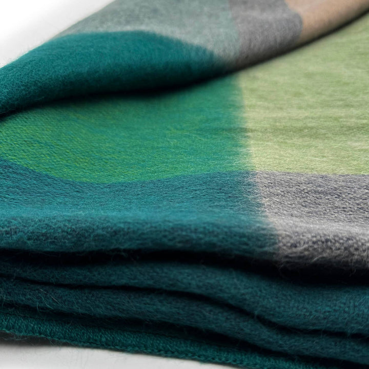 Stack of green and gray fabric swatches