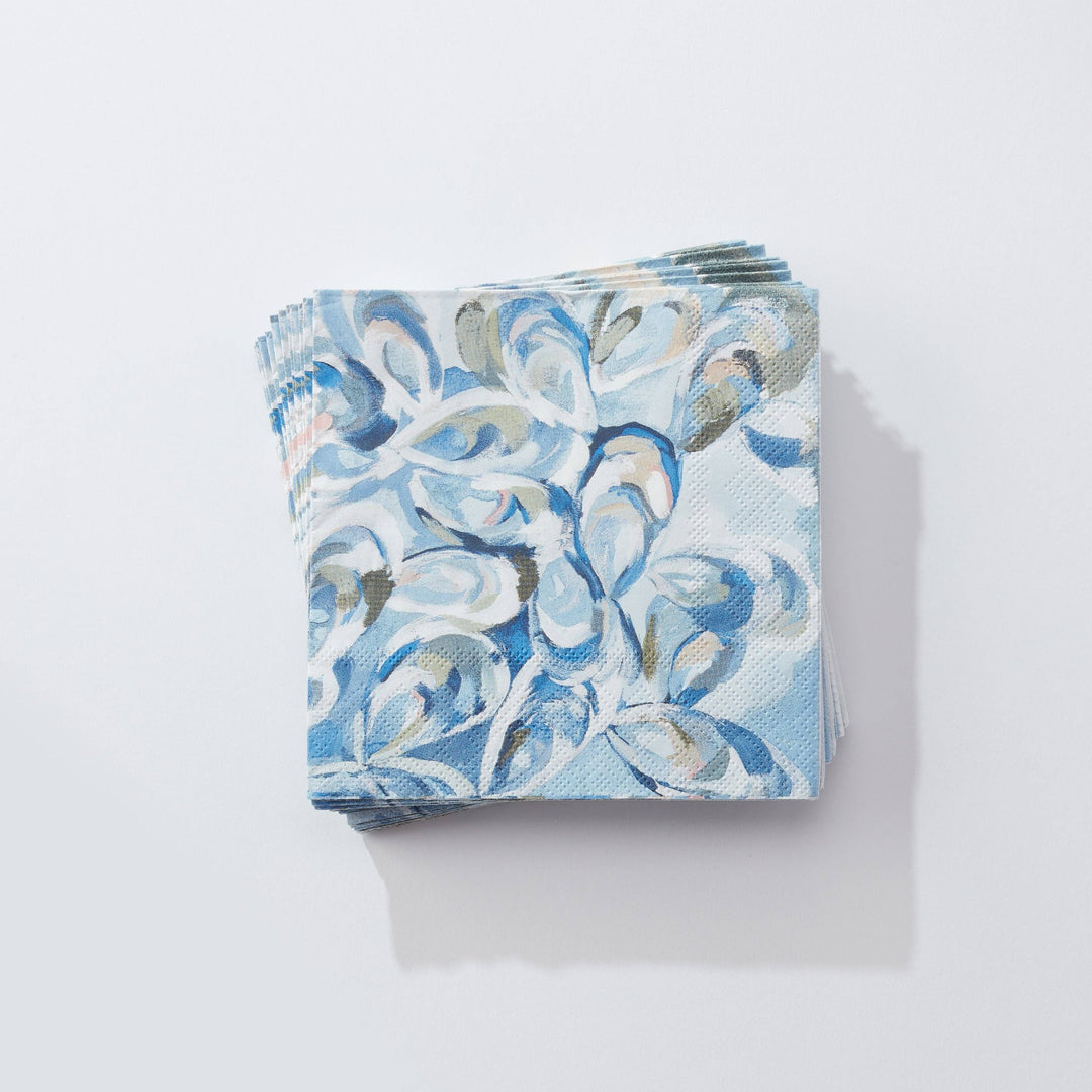 Kim Hovell atlantic reef oyster print blue and white cocktail napkins on a light gray background