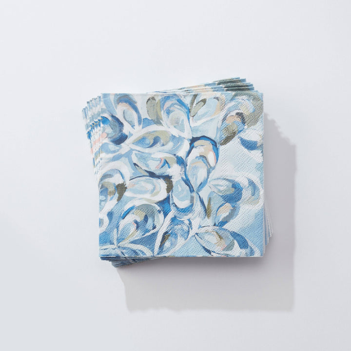 Kim Hovell atlantic reef oyster print blue and white cocktail napkins on a light gray background