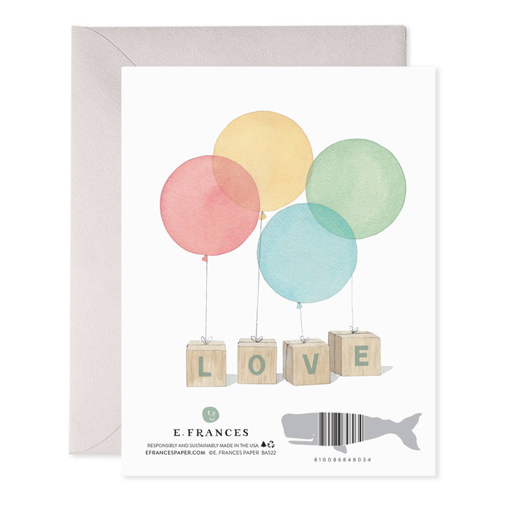 Greeting card with pastel balloons and 'LOVE' blocks, featuring E. Frances Paper branding.