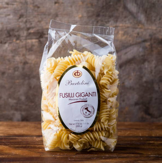 Delicious dry pasta made with artisanal durum wheat flour and cut on bronze molds. Imported from Umbria, Bartolini Fusilli Gigante are large curly cues of delight, ready to cook and serve al dente