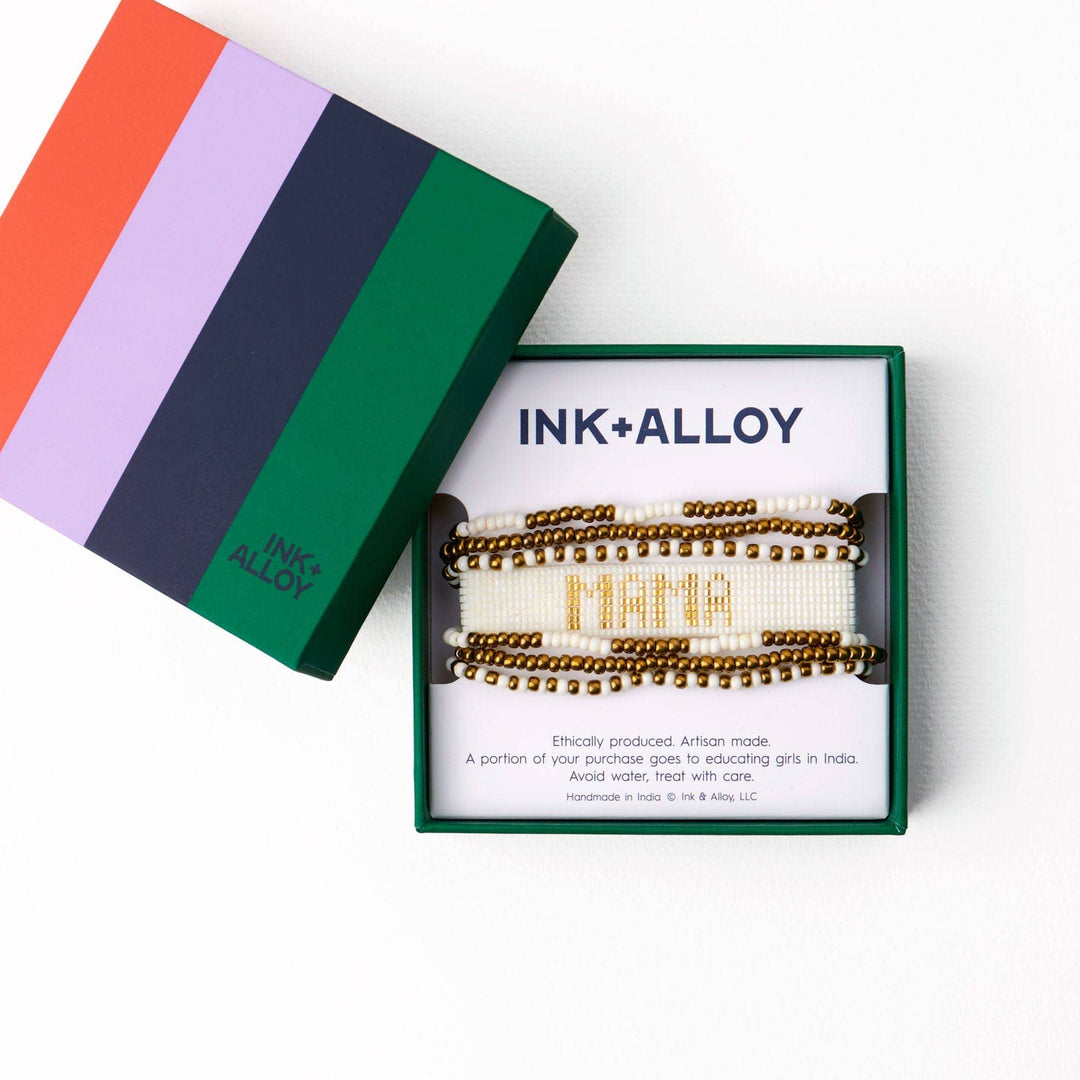 Ink+Alloy hair accessories in a box with colorful packaging on a white background
