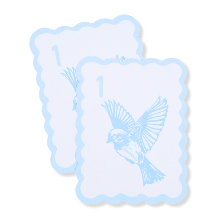 Two scalloped-edge bird bam tile shufflers with a light blue border, pale blue background, the number 1, and a bird illustration, shown on a white background.