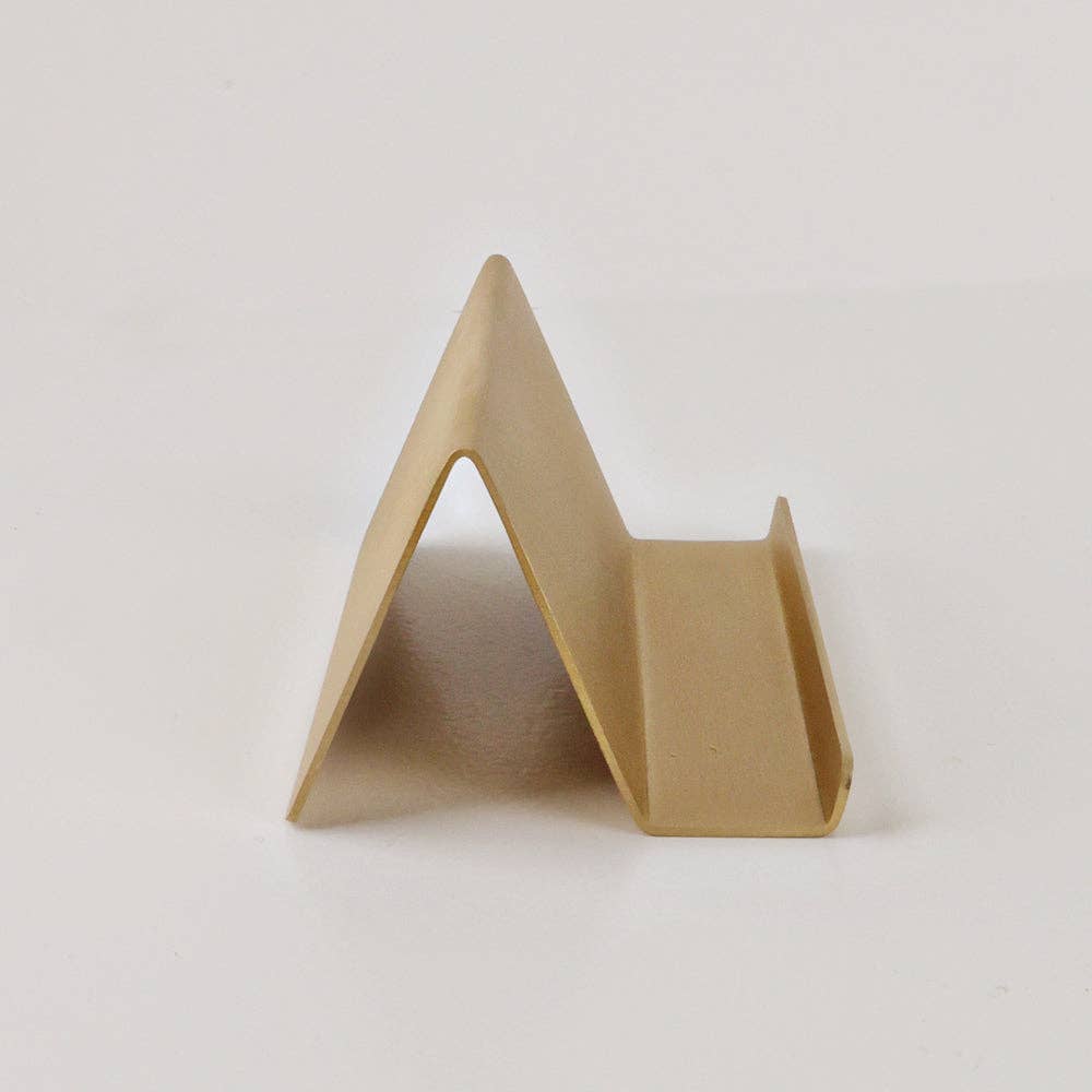 Triangular cardboard stand on a white background