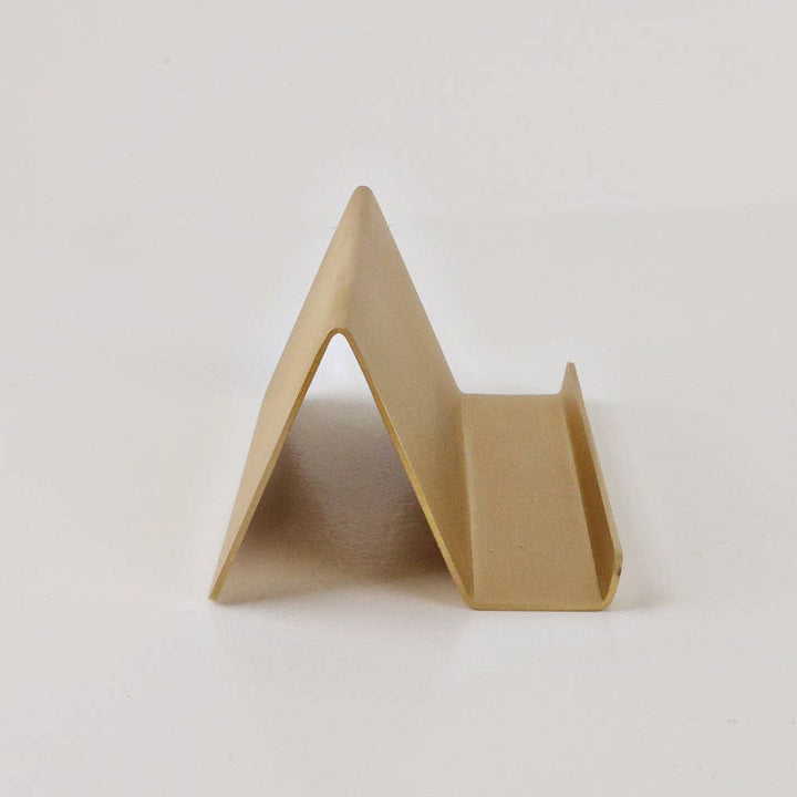 Triangular cardboard stand on a white background