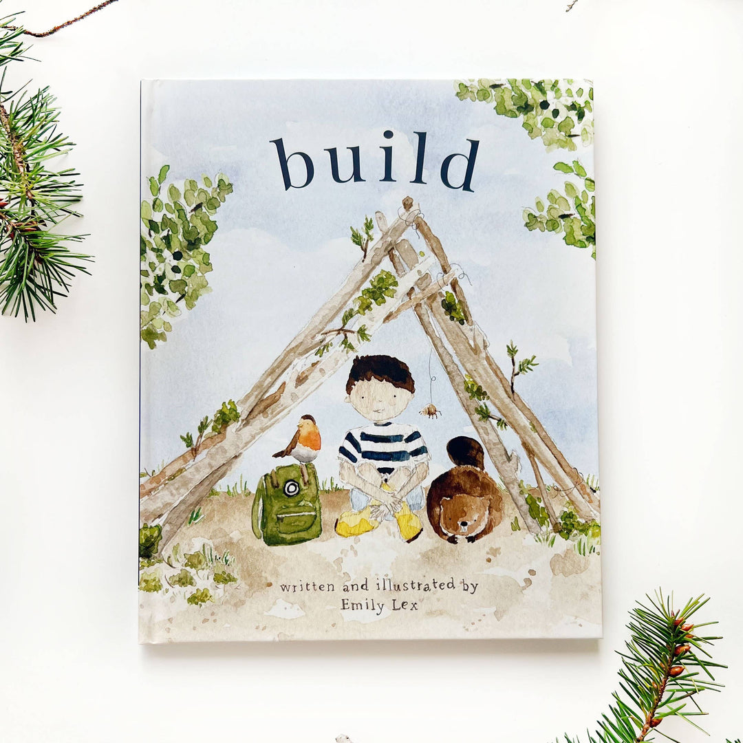 Book cover with illustration of a child, teddy bear, and treehouse, titled 'build'.