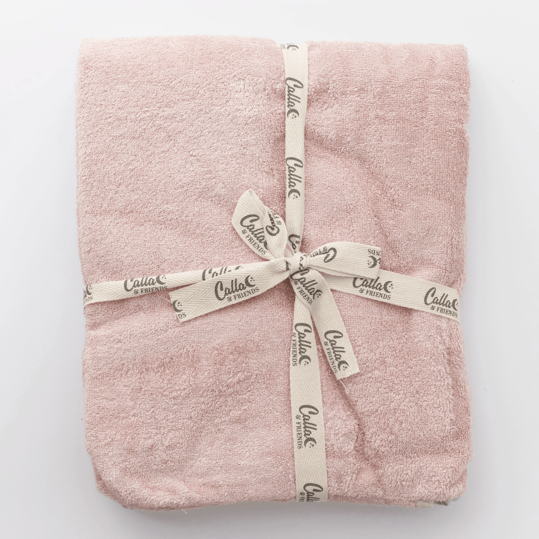 folded pink cotton terry baby towel