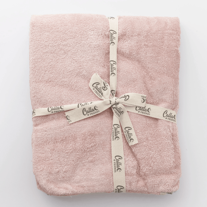 folded pink cotton terry baby towel