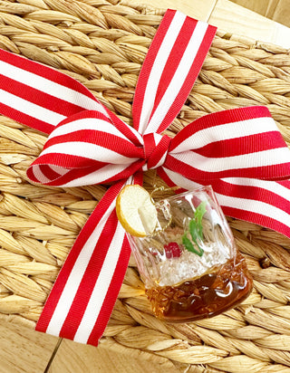 Filled with Bloody Mary mix and salt, Old Fashioned mix, Margarita mix, snacks, garnish and recycled glass lowballs. Packaged in a sustainable hamper, tied with a grosgrain ribbon and topped with a cocktail ornament, it's a go-to gift for the couple who likes to entertain.