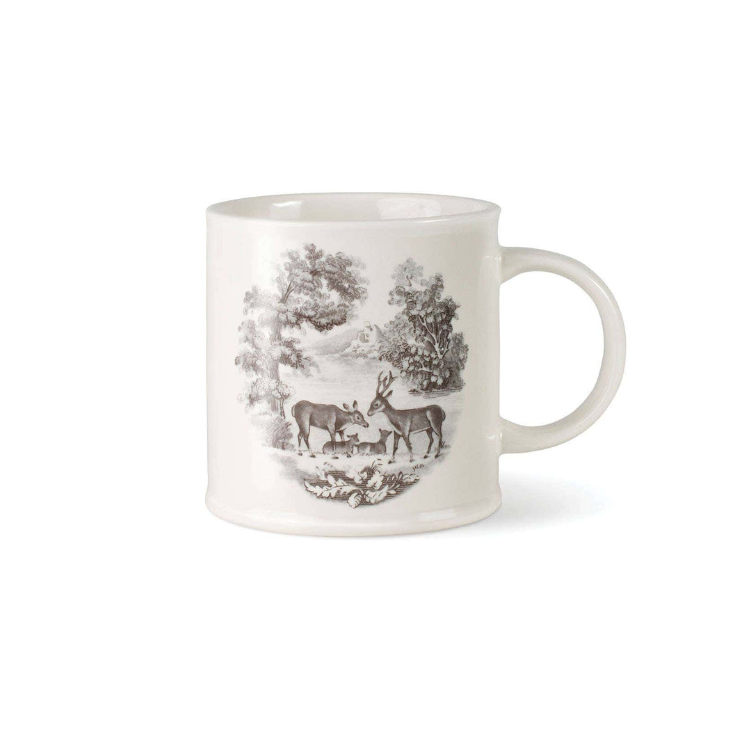 A white ceramic mug featuring a detailed black and gray illustration of deer in a forest landscape, set against a plain white background.