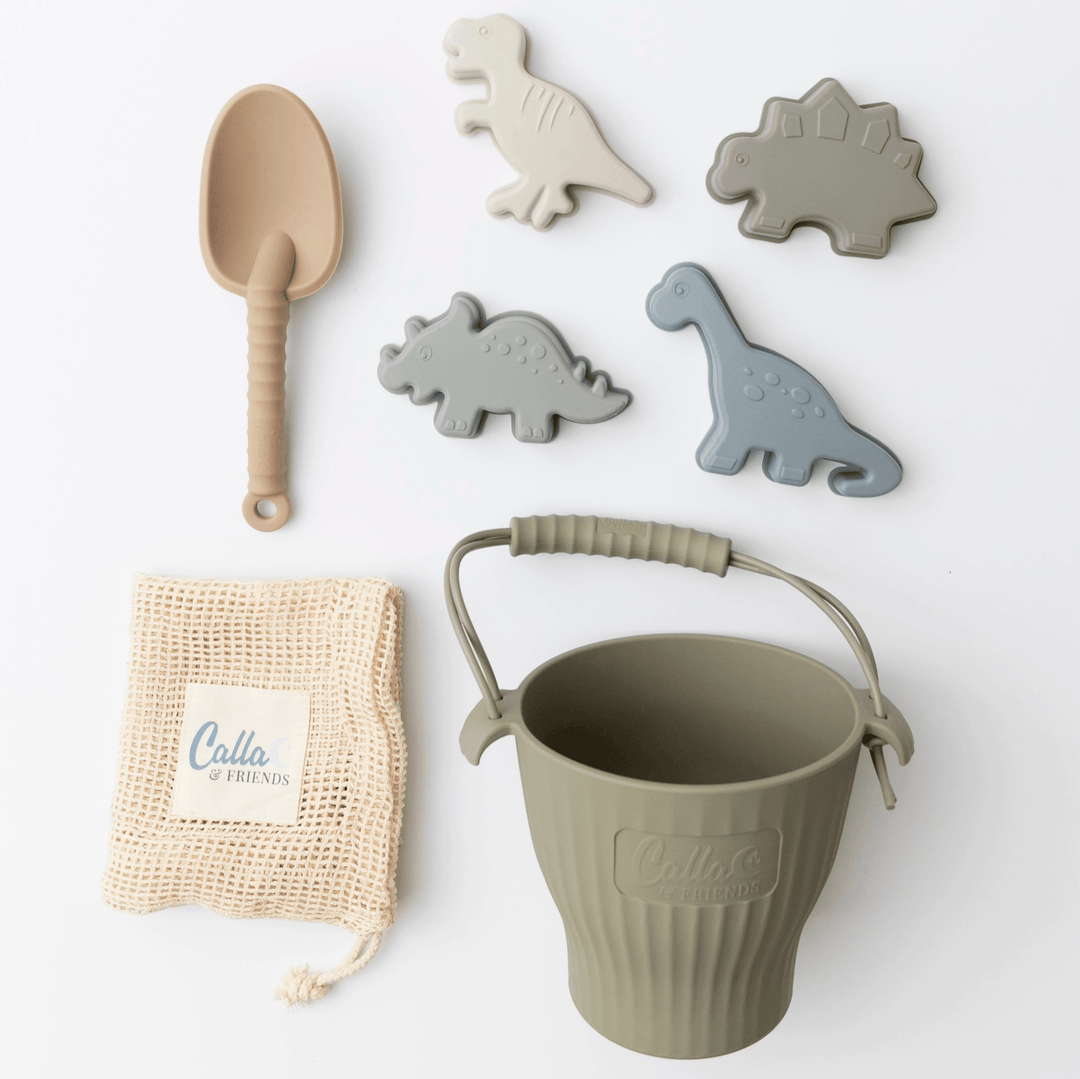 Children's toy set with a bucket, spade, and dinosaur-shaped tools on a white background.