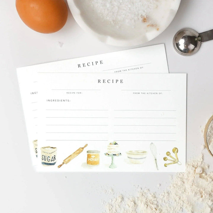 Two Emily Lex illustrated blank recipe cards on a kitchen counter with ingredients around