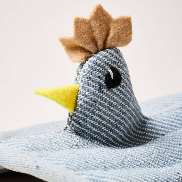 Chicken potholder made of denim and felt.