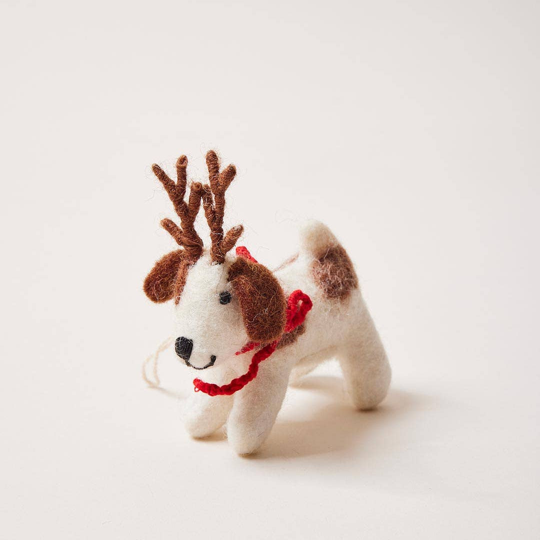 Small dog-shaped reindeer toy with antlers and a red scarf on a light background, branded 'MAX'.