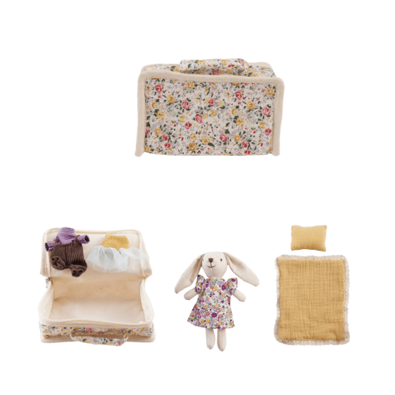 Set of dollhouse furniture including a bed, dresser, and toys on a white background