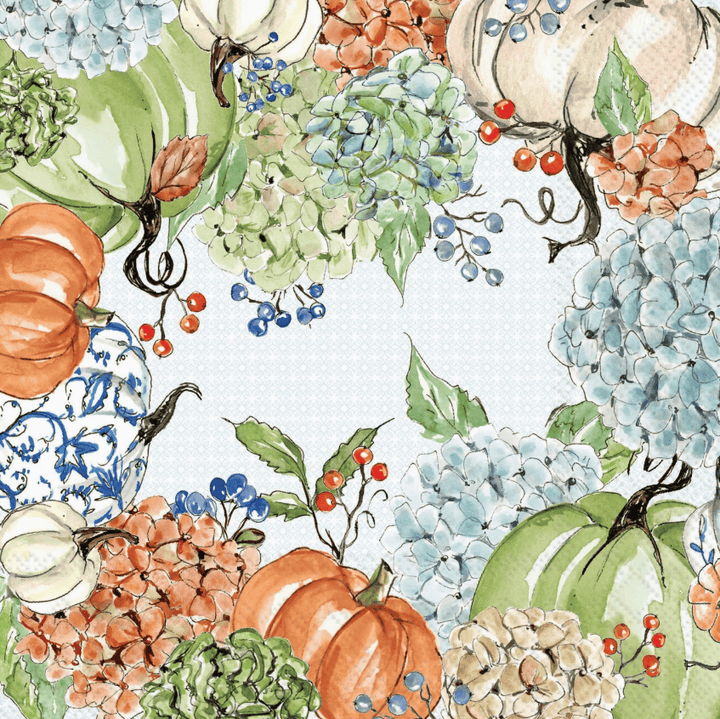 Cocktail napkin with a Watercolor autumn floral pattern featuring pumpkins, hydrangeas, berries, and leaves arranged around a light blue center background.