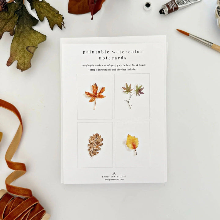 Paintable watercolor notecards with autumn-themed illustrations on a white background.