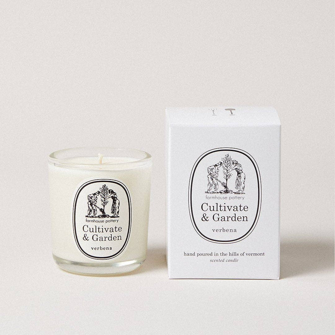 Candle with 'Cultivate & Garden' label and matching box on a white background