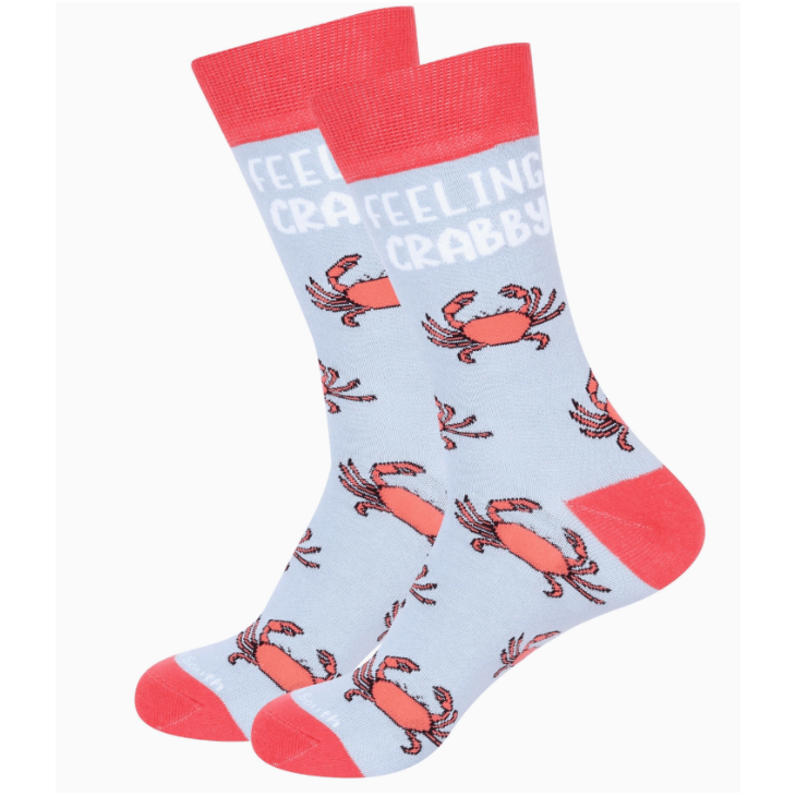 Socks with crab pattern and 'Feeling Crabby' text on a light blue background