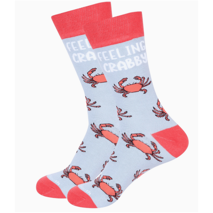Socks with crab pattern and 'Feeling Crabby' text on a light blue background
