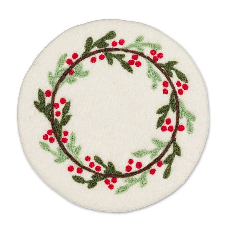 A round off-white felt coaster featuring an embroidered holly wreath with green leaves, red berries, and a brown border, shown on a plain white background.