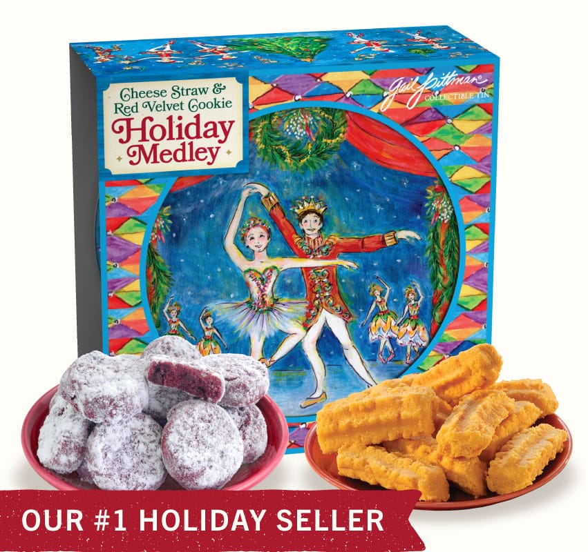 Cookie tin with The Nutcracker theme on the outside shown with cookies on a white background