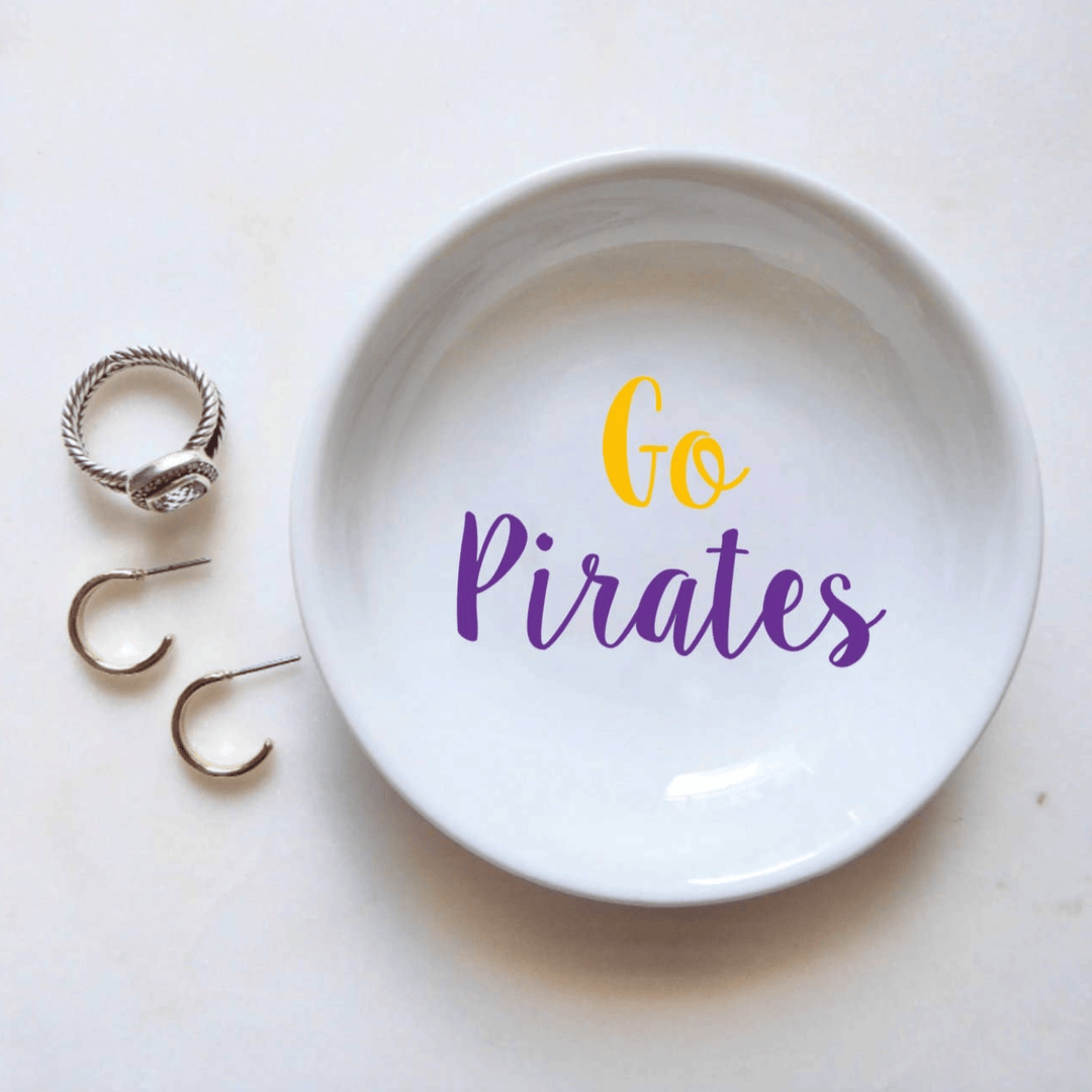 White dish with 'Go Pirates' text and three rings on a white background