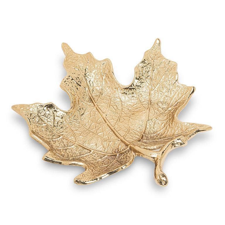 A gold maple leaf-shaped tray with detailed leaf veins, photographed on a clean white background.