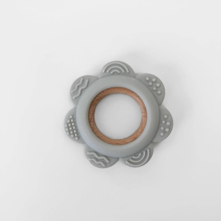 Gray silicone teething ring with wooden center on a white background